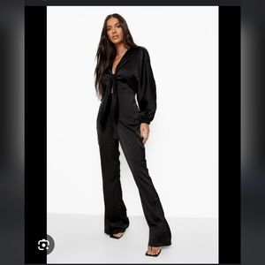 NWT Boohoo silky black long sleeve jumpsuit.